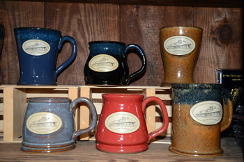 What's better than sitting and reading a book about railroads? Sipping a hot beverage while you do it! Stoneware mugs with an image of the Depot are available in a variety of styles and colors for $23.95. These mugs are made in the USA by Sunset Hills Stoneware.