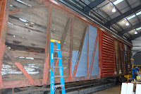 Northern Pacific boxcar receiving new paint.