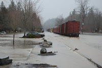 Flooded tracks, train and parking lot during January 2009 flood along Railroad Ave.