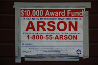 Arson information award sign on Snoqualmie Depot.