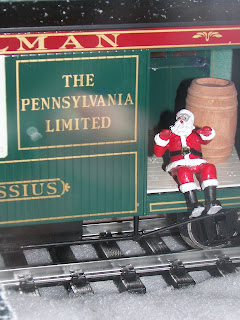 Santa on model train.