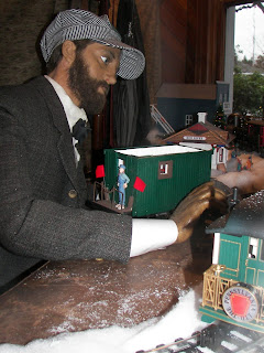 Wax mannequin Clarence serves as telegrapher in window of Snoqualmie Depot to help interpret the ticket office.