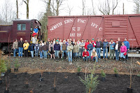 Scouts pose with train after restoring wetland buffer.