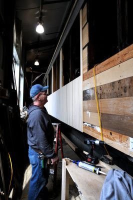 Bob installs siding.