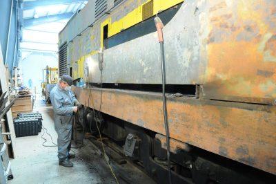 Removing rust from White River Lumber Co locomotive 1.