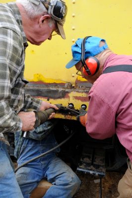 Installing new rivets on caboose.