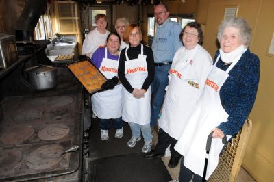 Volunteers baking cookies.