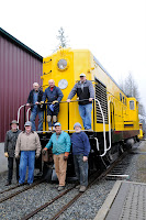 Locomotive 1 and just a few of the dozens of people involved in its rehabilitation. Top, left to right, Allan W., Bob M., Clark Mc., Hugh H., Jon B., Roger S., & Russ S.