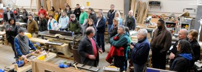 Group watches demonstrations inside Conservation and Restoration Workshop