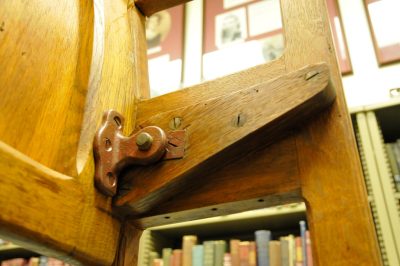 Detail view of chapel car pew back, hinge, and seat support. Seat is from sister chapel car "Herald of Hope" and is held at ABHS.