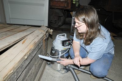 Cristy L. demonstrating a new Nilfisk HEPA museum quality vacuum.