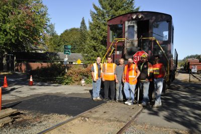 Asphalt By George crew posing with locomotive #4024 at Northern St. crossing.