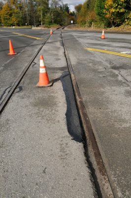 North Bend Way crossing showing asphalt repairs.