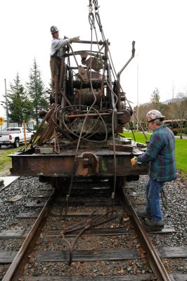 1903 steam crane being prepped for lifting.