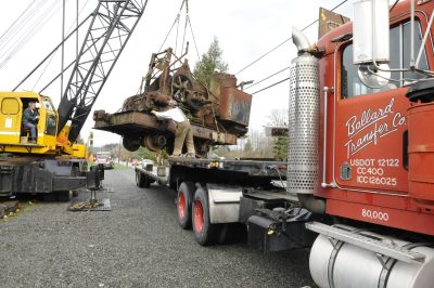 1903 steam crane being lifted by Imhoff's crane onto a Ballard Transfer, Co. truck.