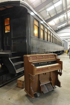 Shadduck family's Estey Organ next to Messenger of Peace.