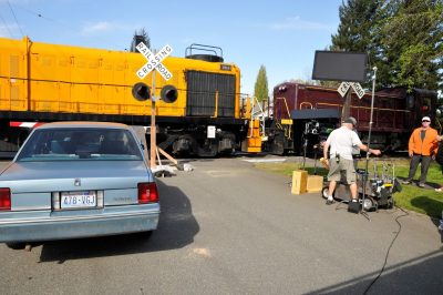 Former KCC RSD-4 #201 and the Museum's #4012 sit at a crossing during filming of Washington Lottery's "Conductor" commercial.