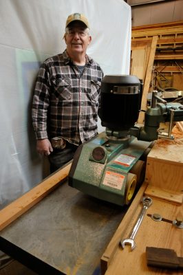 Bob next to the new 1HP Grizzly power feeder.