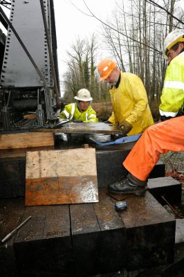 Metal soul plate being inserted into place on Bridge 35.