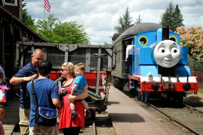 Thomas rolls by the Snoqualmie Depot while visitors talk during DOWT 2014.