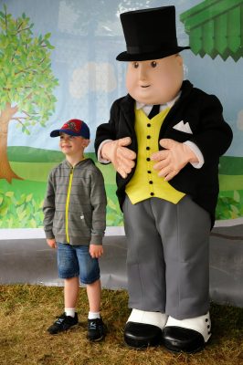 Sir Topham Hatt posing with a young visitor during DOWT 2014.