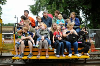 Families sitting aboard the Speeder trailer ready for a ride during DOWT 2014.