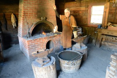 Blacksmith demonstrating at Fort Nisqually, 2015.