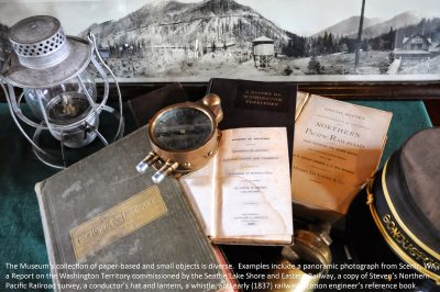 A collection of some of the Museum's paper-based and small objects. A caption is edited into the image.