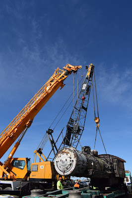 The 1246's boiler is picked up by a pair of cranes and set on a truck.
