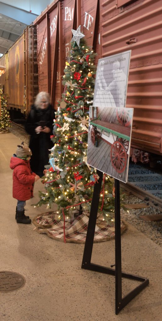 Seasonal decorations adjacent to the Northern Pacific boxcar.