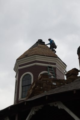 New shingles being installed on the turret.