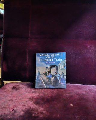 The book Across America on an Emigrant Train sitting on a chair in SP&S 218.