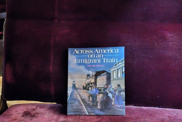 The book Across America on an Emigrant Train sitting on a chair in SP&S 218.