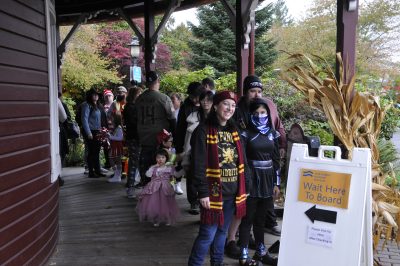 Costumed families wait to board Halloween Train 2024 at Snoqualmie Depot