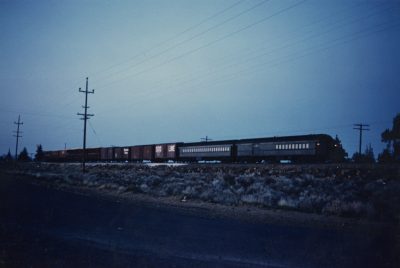 SP&S Oregon Trunk train with 272 or 273 and extra coach on freight train. Museum collection.