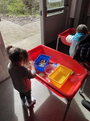 Story Time 2024 participants enjoy sensory tables.