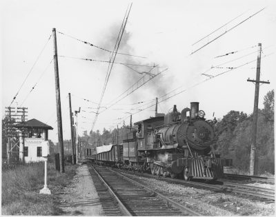 A Pacific Coast Railway steam locomotive pulls a freight train past Black River tower outside Tukwila October 22, 1935. Charles Turner photo.