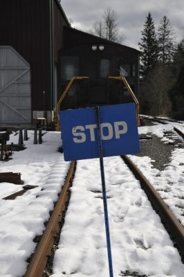 A Blue Flag is raised between the tracks. Behind the Blue Flag is SVR 4012 and the CRW.