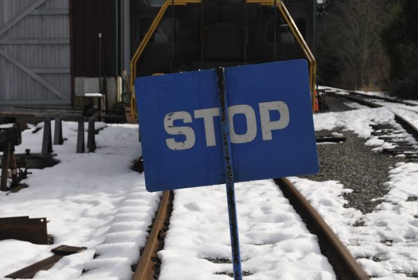 A Blue Flag is raised between the tracks. Behind the Blue Flag is SVR 4012 and the CRW.