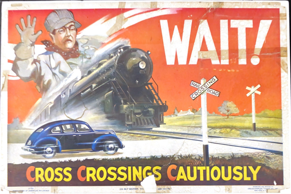 Old advertisement with a steam locomotive and a car speeding towards a crossing. A train engineer is seen behind the locomotive putting his hand out to say "stop", and "WAIT!" is in big white letters to the right of the locomotive. At the bottom are the words "Cross Crossings Cautiously" in yellow with each "c" in orange.
