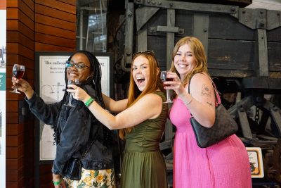 Guests lined up with their wine glasses at the Train Shed.