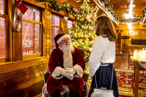 Santa visits with a young visitor in the chapel car during Santa Train. Photo courtesy Chris Neir.