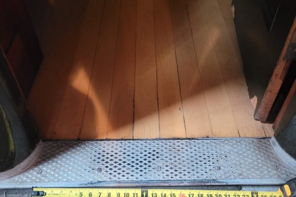 Entryway to coach 218, there is a slight bump of a threshold.