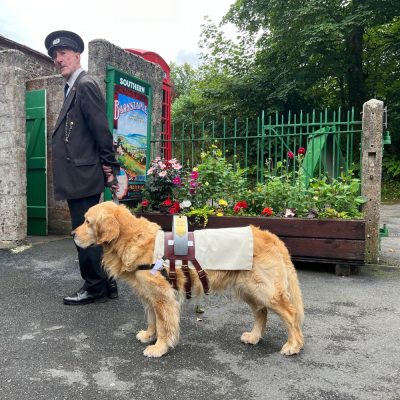 Collection dog Henry and his human John Bond at Woody Bay on the Lynton & Barnstaple Railway. Photo courtesy Lynton & Barnstaple.