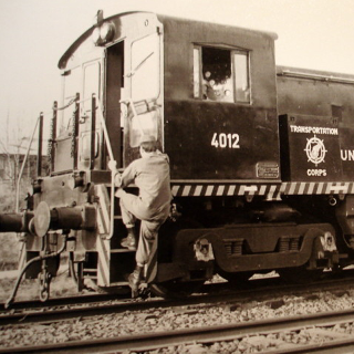 Cropped historic photo of 4012 in service in West Germany. The buffers visible to the left on the rear of the locomotive.