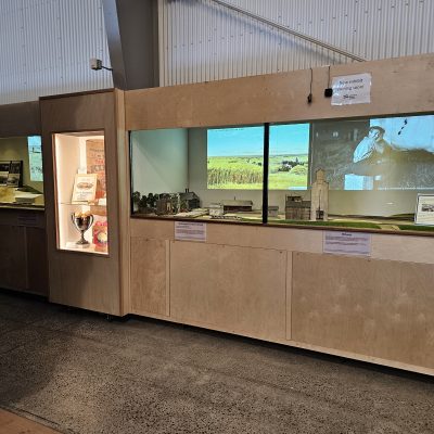 The display cabinets of "From Farm to Rail to Table". The exhibits are in, exhibit panels are up, and the layout is progressing.