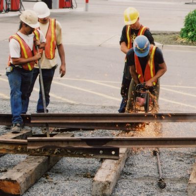 Track workers cutting rail to unload RS-4-TC #4024