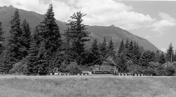 RS-4-TC #4012 aboard a lowboy trailer leaves I-90 with Mt. Si in the background.